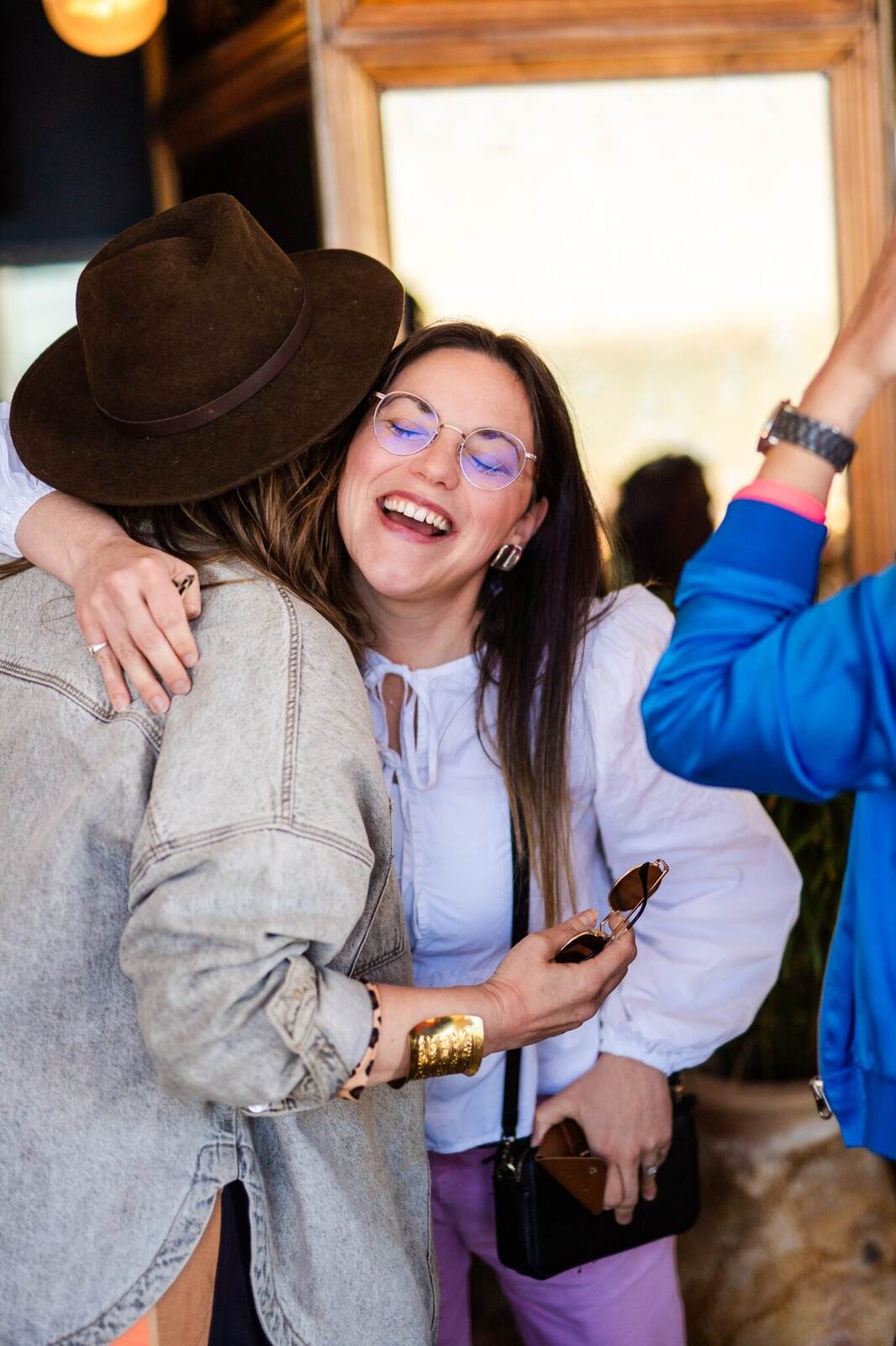 Guests greeting one another warmly at a house of hopium gathering