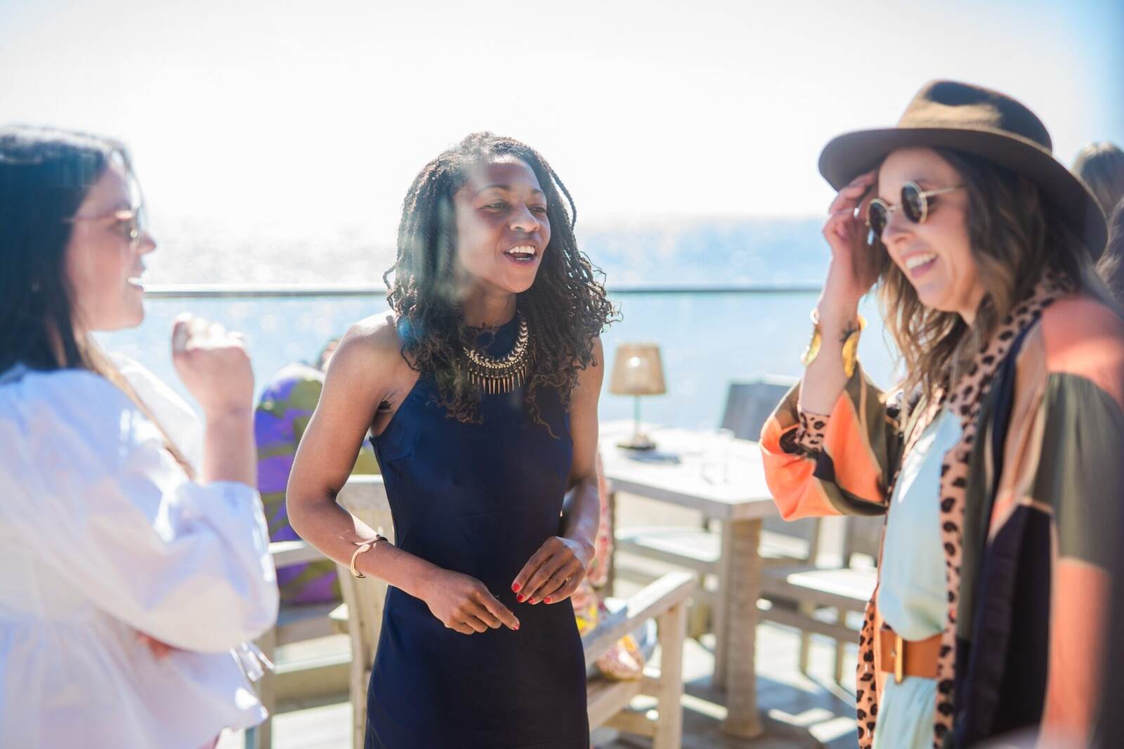 Friends laughing together at a house of hopium gathering