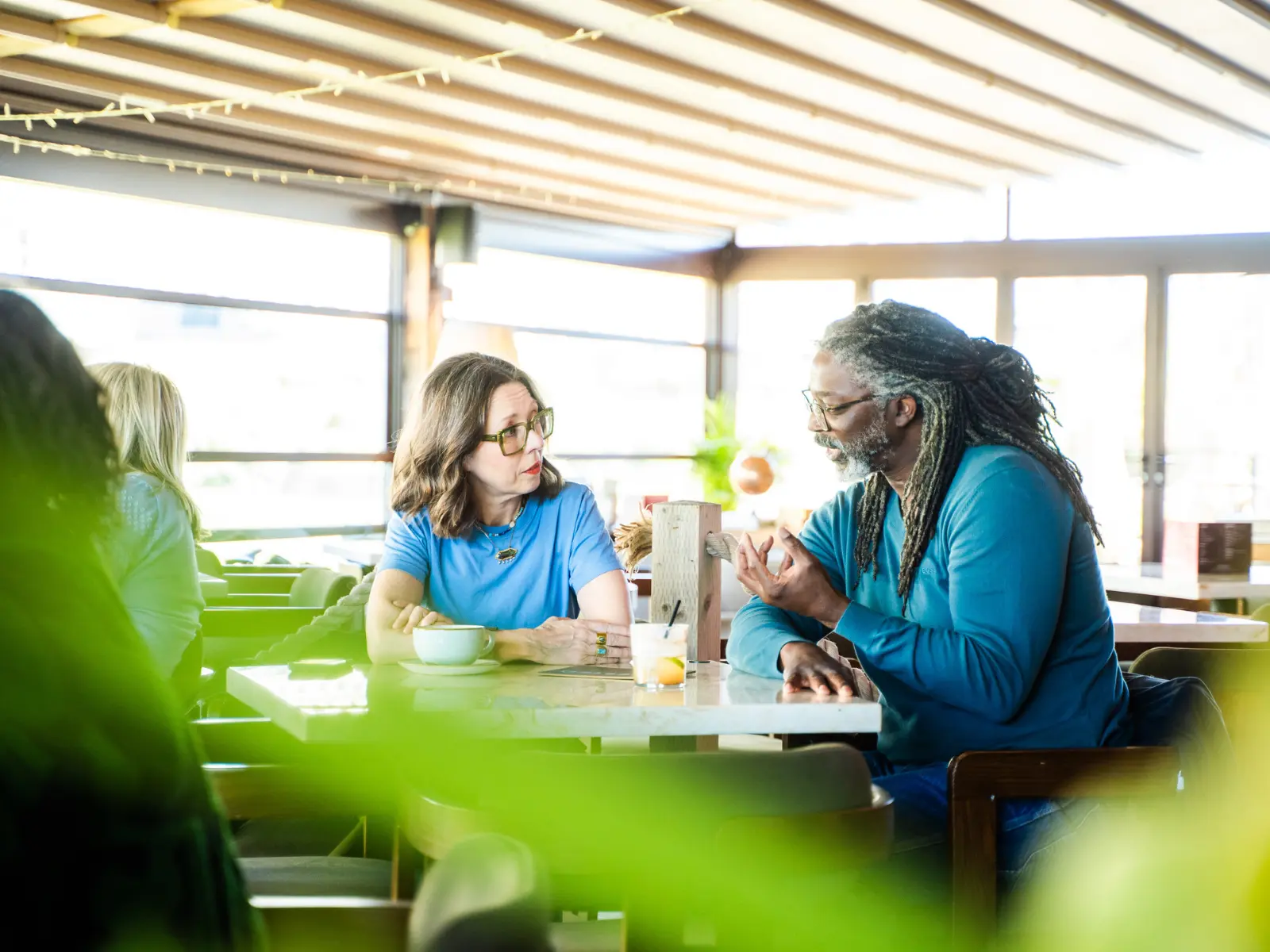 Two people in conversation at an Inspiration Space gathering photographed by Vicki Knights