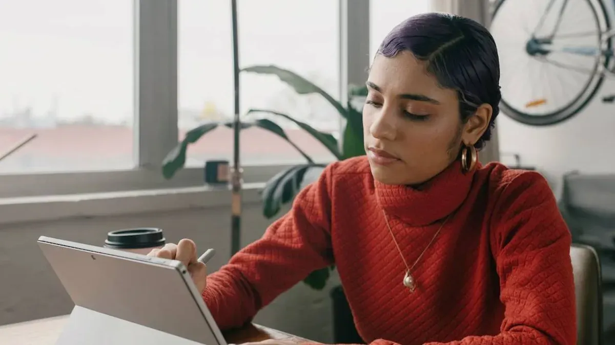 Focused entrepreneur working on high-priority business tasks - The Inspiration Space